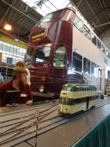 Model with large tram behind