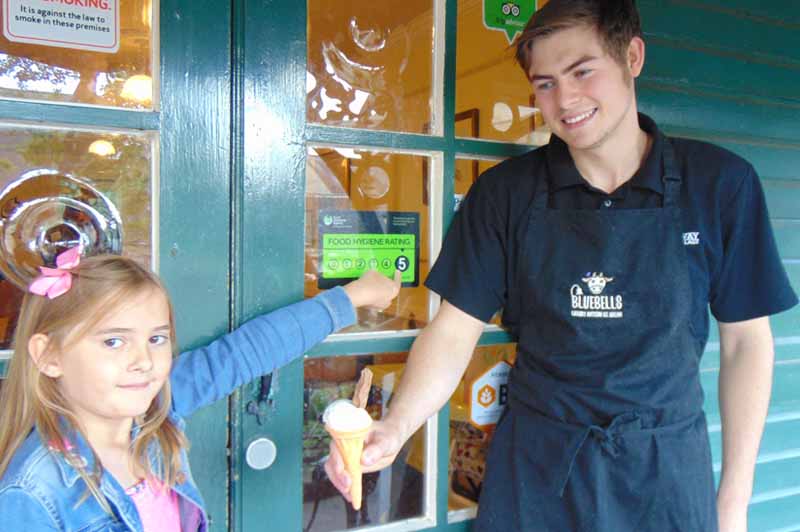 Volunteer serving ice cream